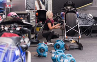 Angie working on DENSO sponsored motorcycle